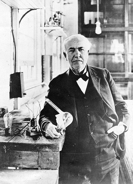 Thomas Alva Edison with his light bulb invention